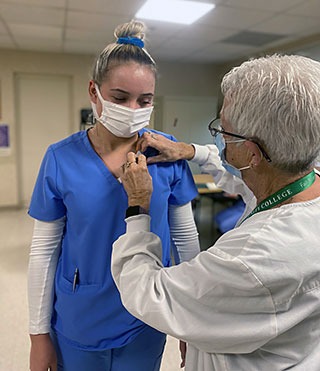 Bristol's CNA instructor and student