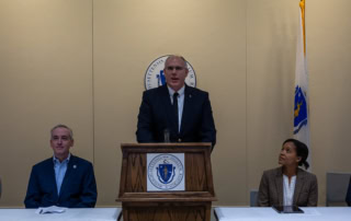 Photo of Veterans Employment Representative/DVOP Specialist Speaking at Senate Room 428 at the State House in Boston on October 31, 2024 for the State's Veterans services event.